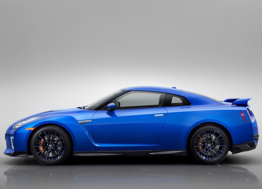 An image of a blue Nissan GT-R in a photo studio.