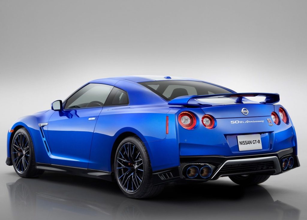 An image of a blue Nissan GT-R in a photo studio.