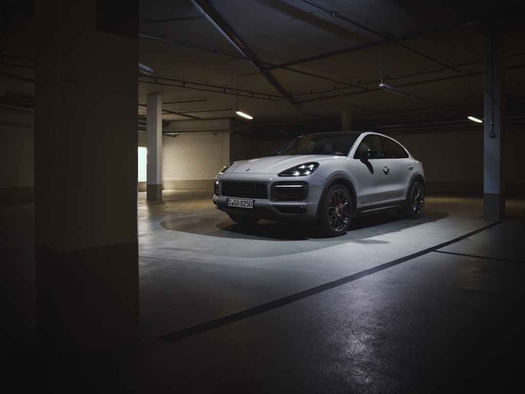 white 2021 Porsche Cayenne GTS in a fancy garage