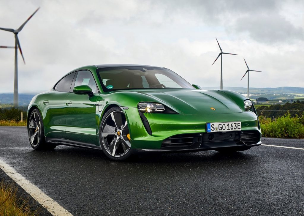 An image of a green Porsche Taycan Turbo S parked outside.
