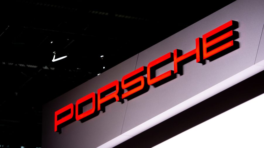 Red Porsche logo on a gray background