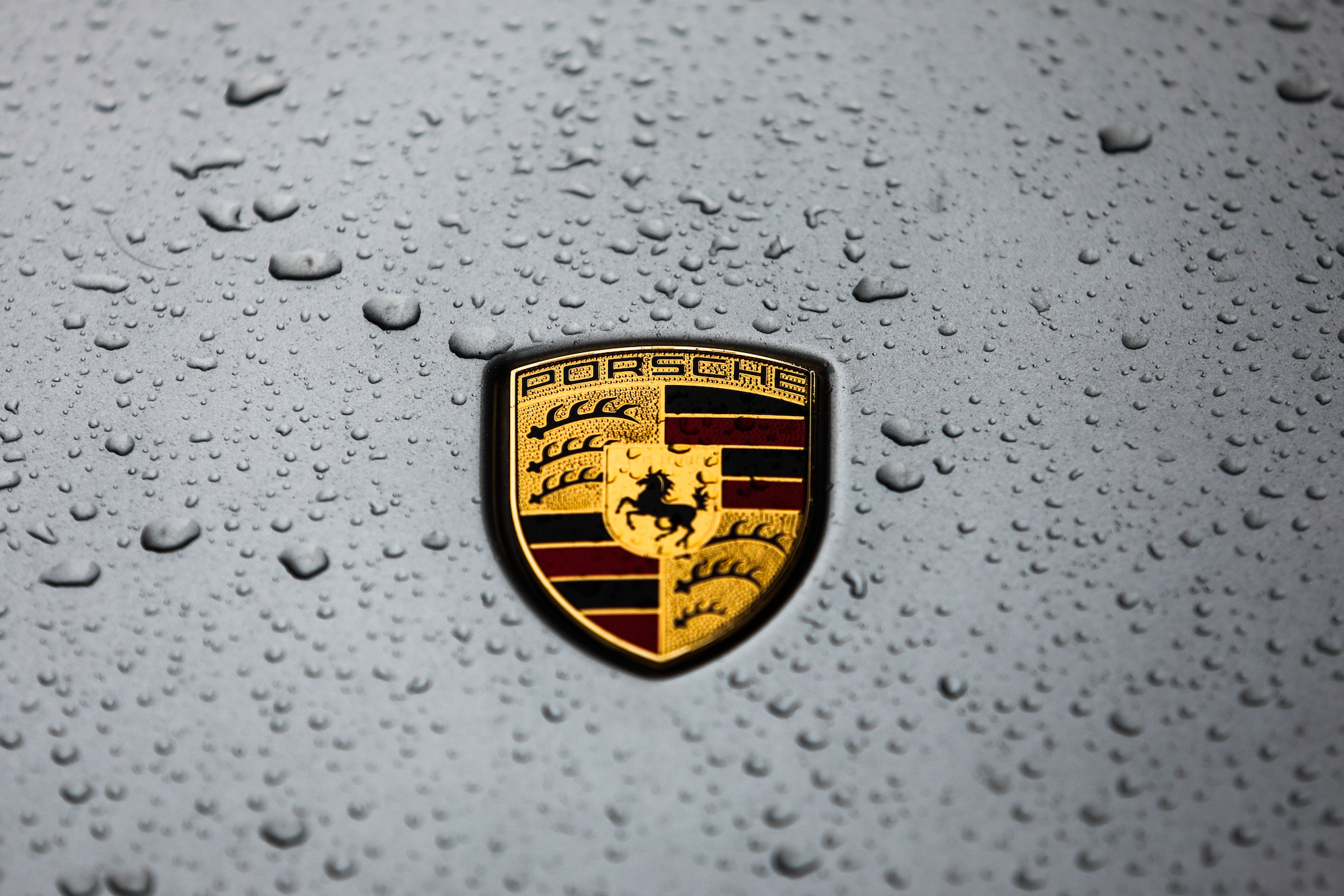 Raindrops on a Porsche logo on a car in Krakow, Poland, on January 5, 2020.