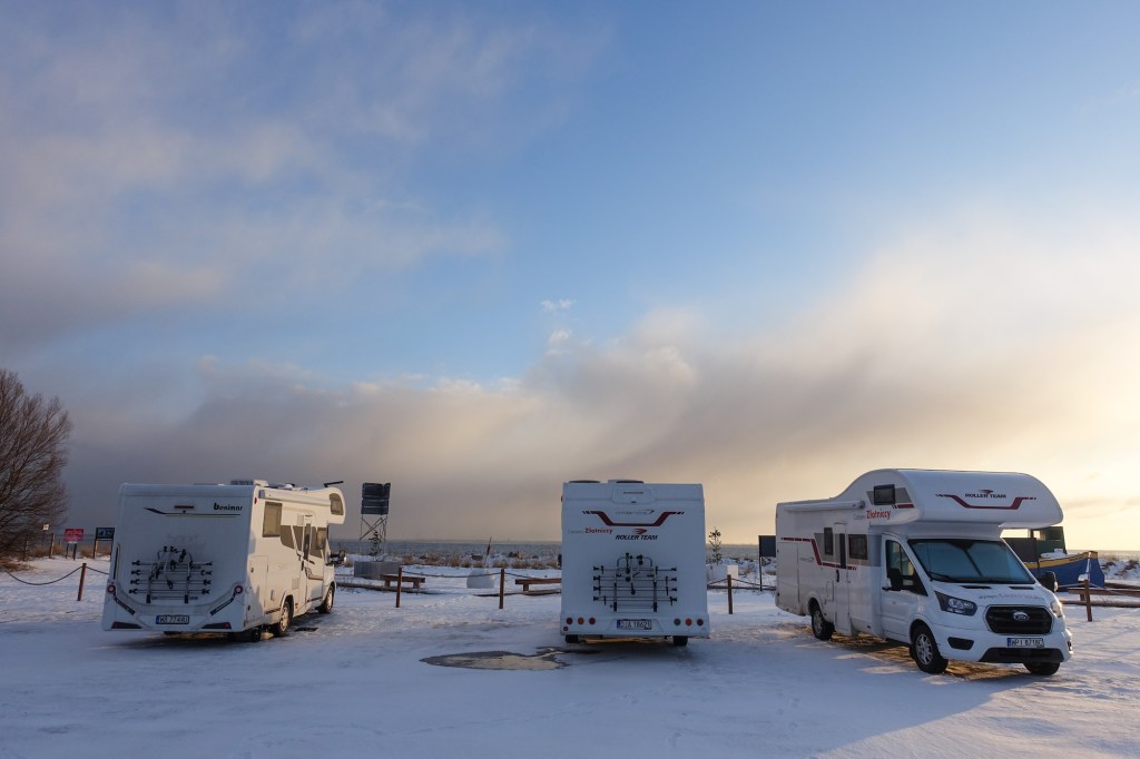 RVs parked by the sea in Mechelinki, Poland, on February 6, 2021