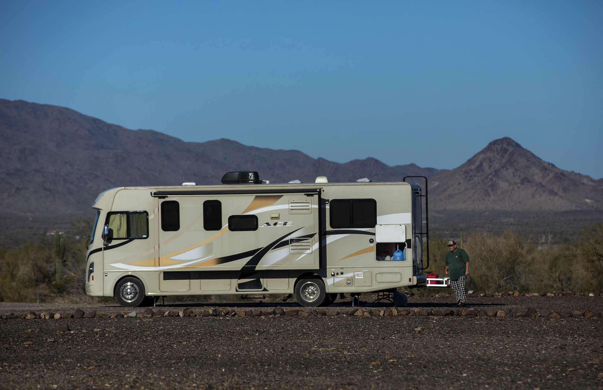 Paul Ostrom, age 67, of Sandpoint, Idaho, walks outside his RV, parked at the La Posa long-term visitor area in Quartzsite, Arizona