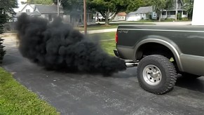 Pickup truck rolling coal