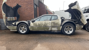 An image of a Ferrari 512 BBi parked outside.