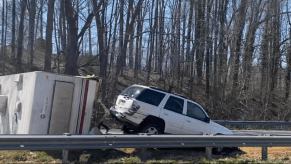 A wrecked RV and Chevy Trailblazer blocking I-40