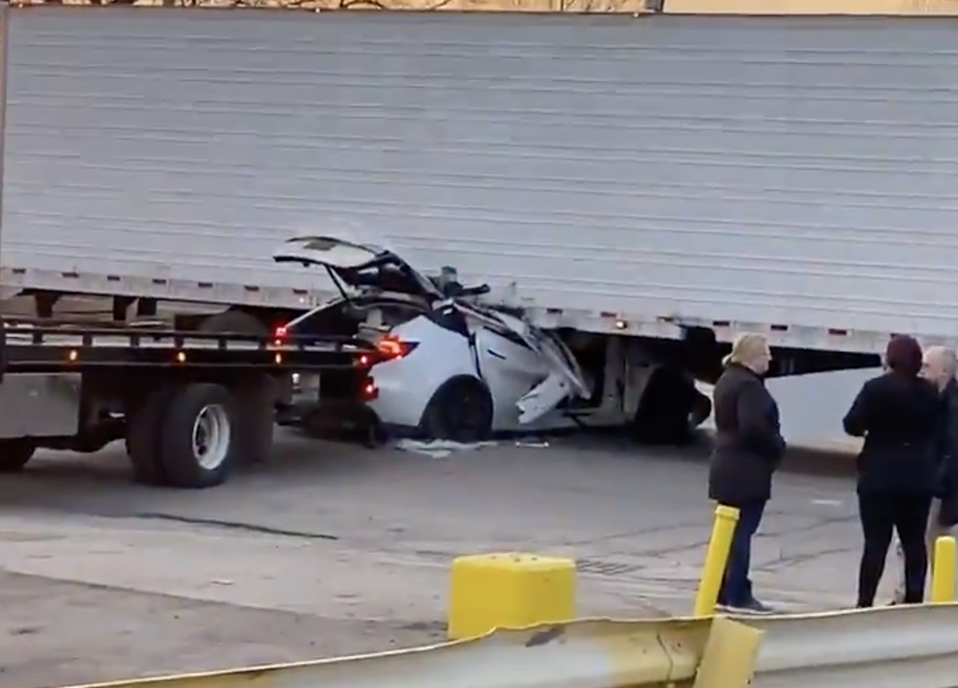 An image of a Tesla Model Y that crashed into a semi truck.