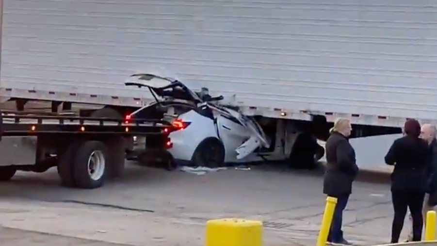 An image of a Tesla Model Y that crashed into a semi truck.