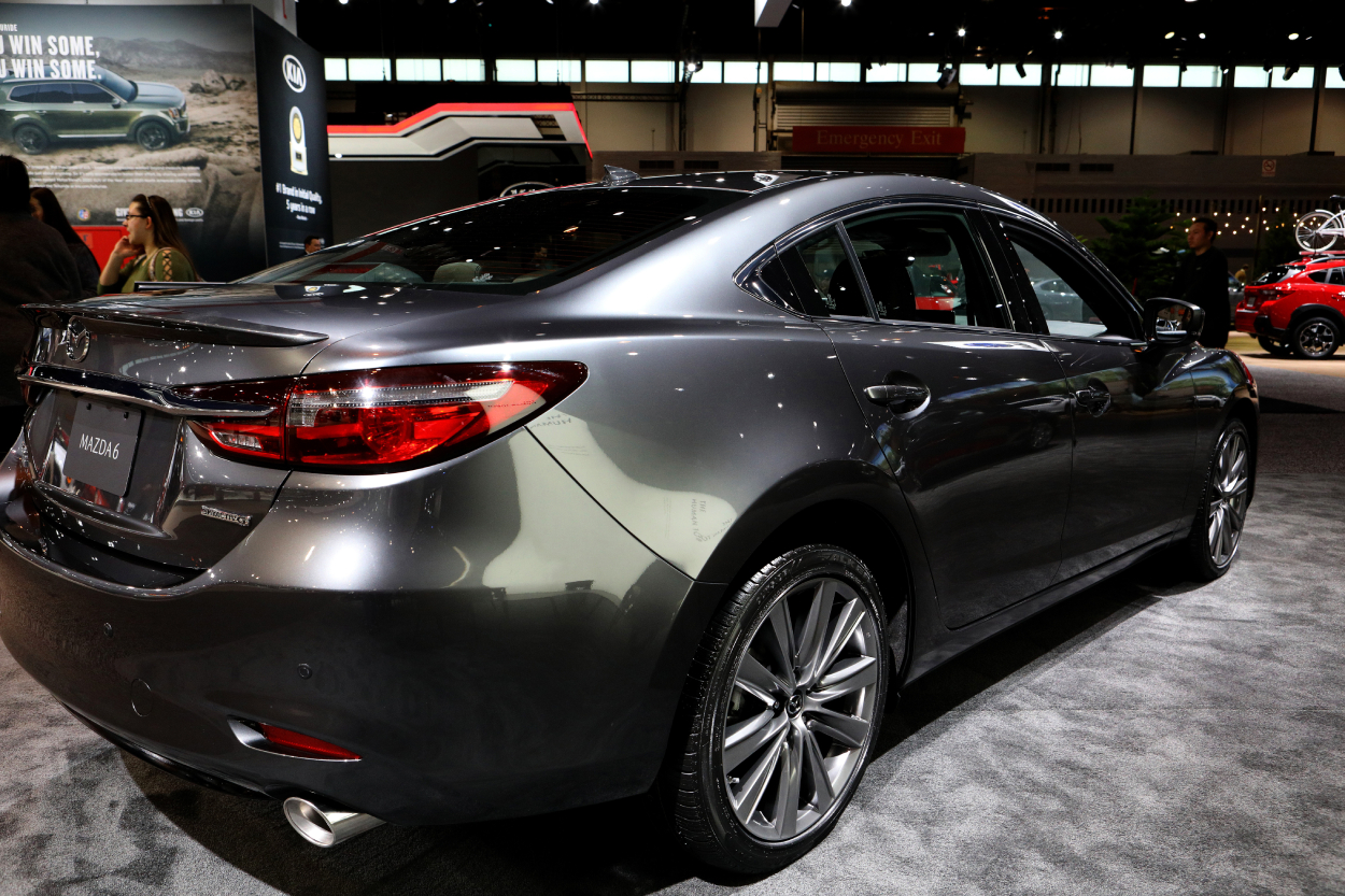 A silver Mazda6 on display at an auto show