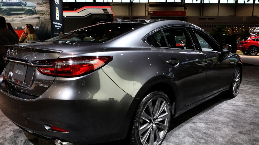 A silver Mazda6 on display at an auto show
