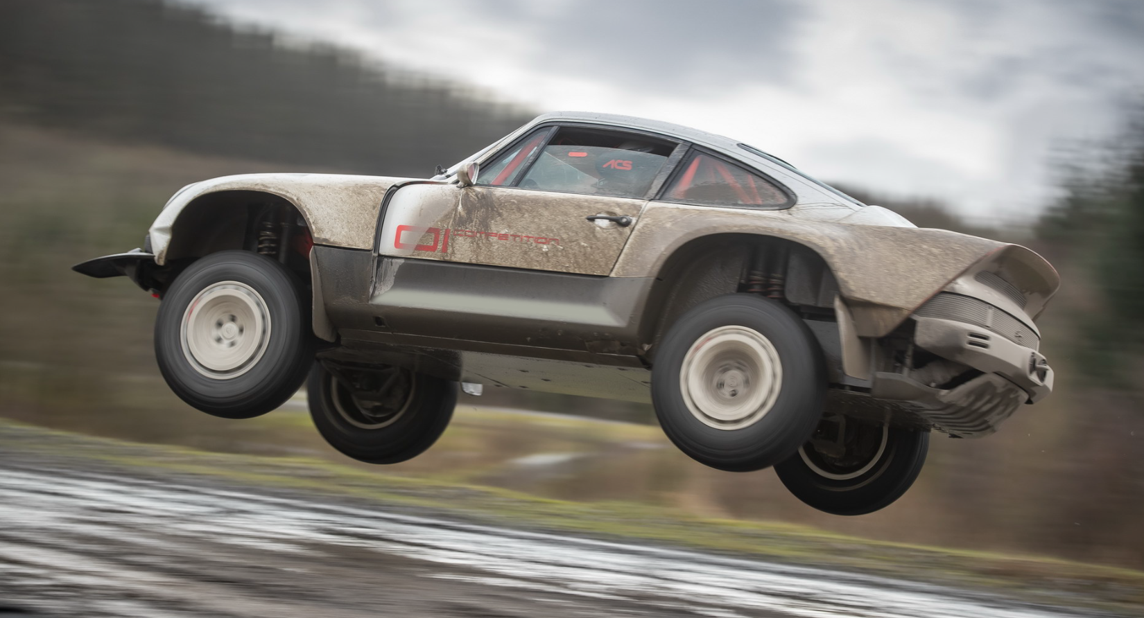 Singer ACS Porsche flying in jump