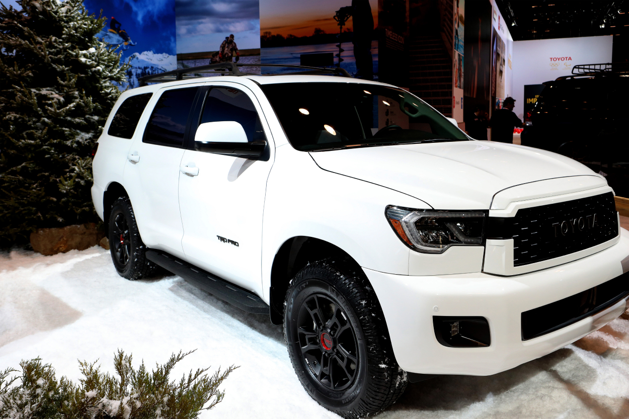 A white Toyota Sequoia on display at an auto show