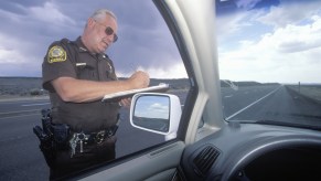 A police officer writing a speeding ticket