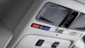 A Subaru Starlink kiosk installed above a vehicle's windshield inside the cabin