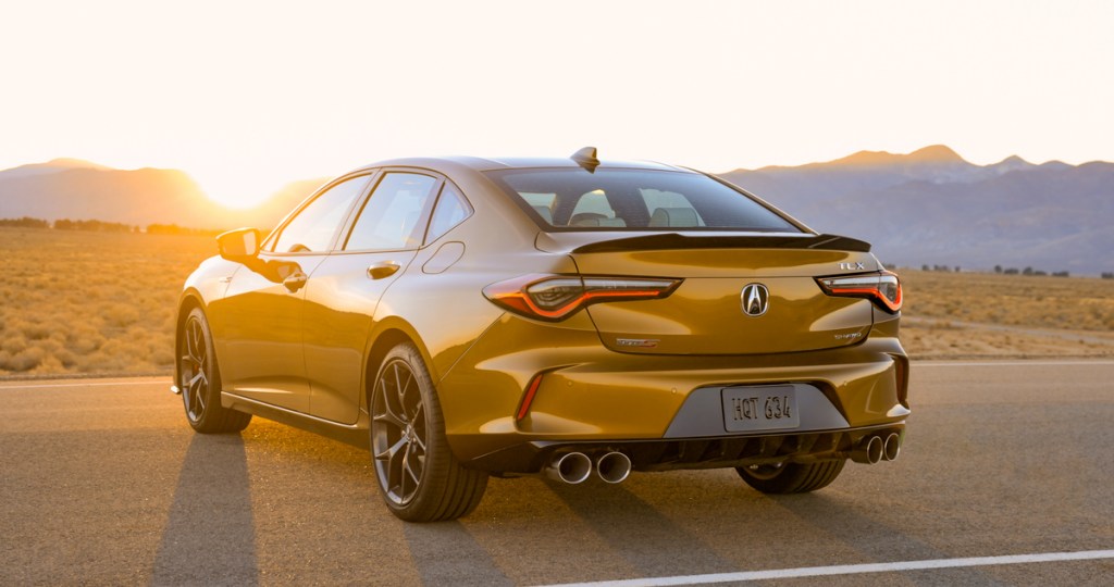 a rear shot of the 2021 TLX Type S shown in Tiger Eye Pearl paint
