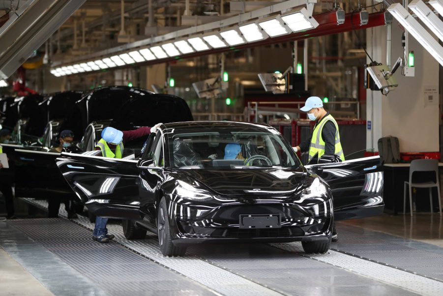 Employees work at the Tesla Gigafactory in Shanghai, east China, Nov. 20, 2020. U.S. electric car company Tesla in 2019 built its first Gigafactory outside the United States
