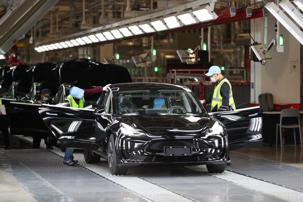 Employees work at the Tesla Gigafactory in Shanghai, east China, Nov. 20, 2020. U.S. electric car company Tesla in 2019 built its first Gigafactory outside the United States