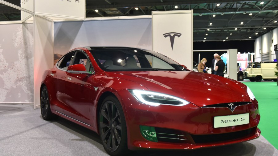A red Tesla Model S four-door electric car on display during the London Motor & Tech Show at ExCel on May 16, 2019, in London, England
