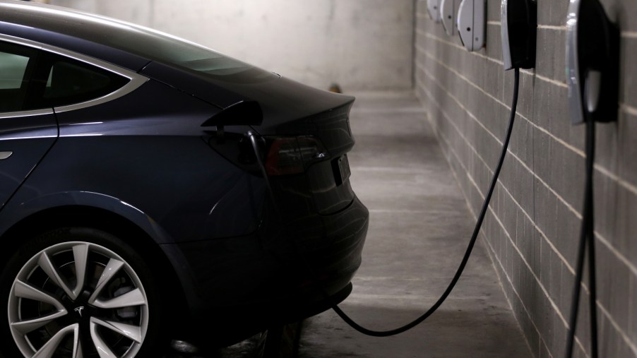 A Tesla Model Y plugged in and charging at home