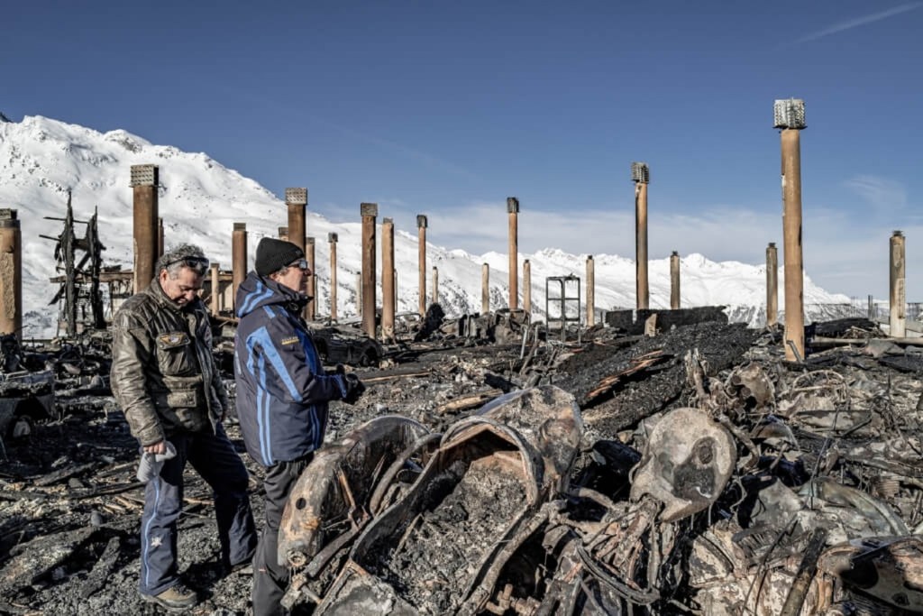 The Scheiber brothers at the burned remnants of the Top Point Motorcycle Museum