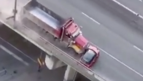 Toronto dump truck dragging a Mini sideways