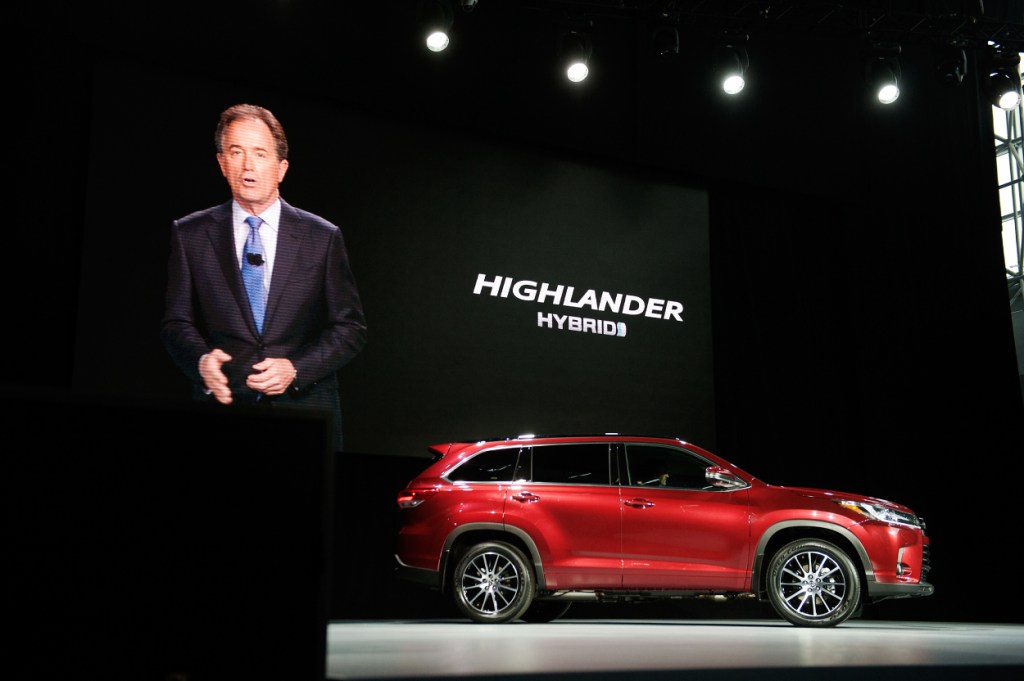 A new Toyota Highlander Hybrid being unveiled at an event