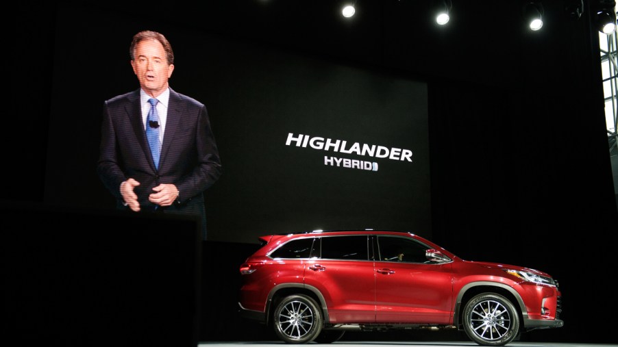 A new Toyota Highlander Hybrid being unveiled at an event