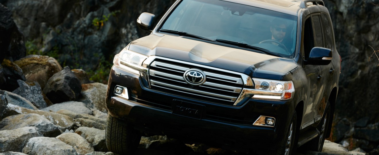 The Toyota Land Cruiser climbing over rocks