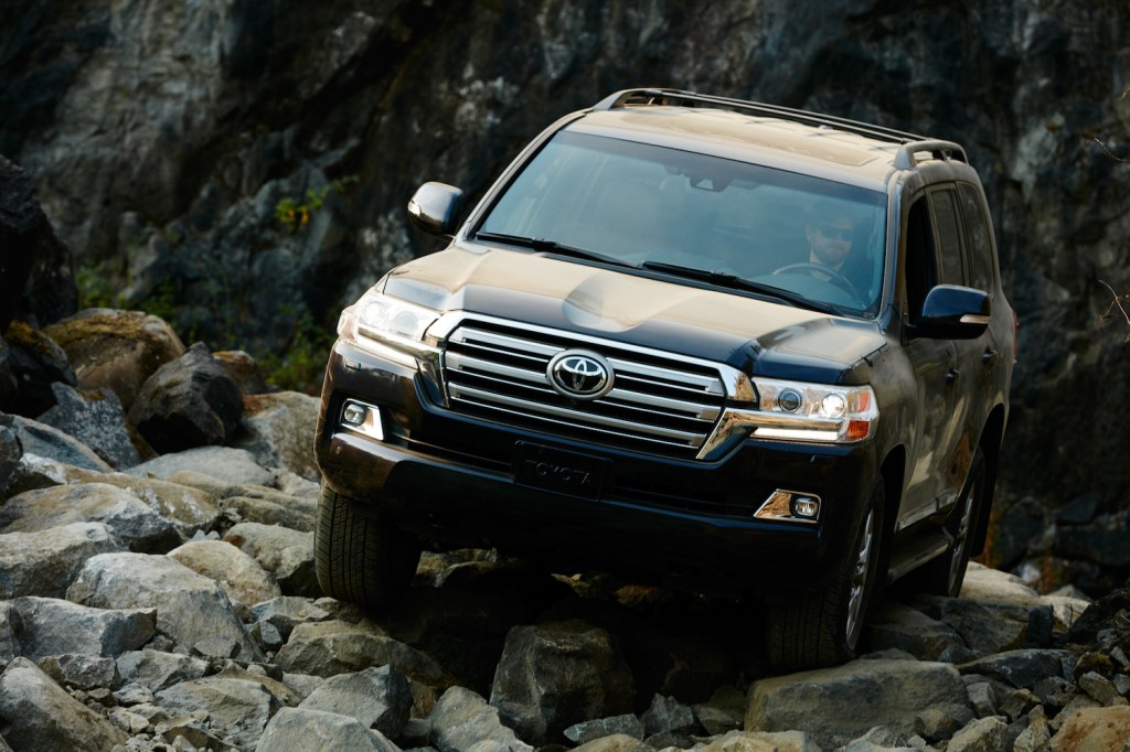 The Toyota Land Cruiser climbing over rocks