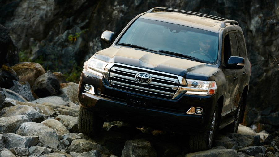 The Toyota Land Cruiser climbing over rocks