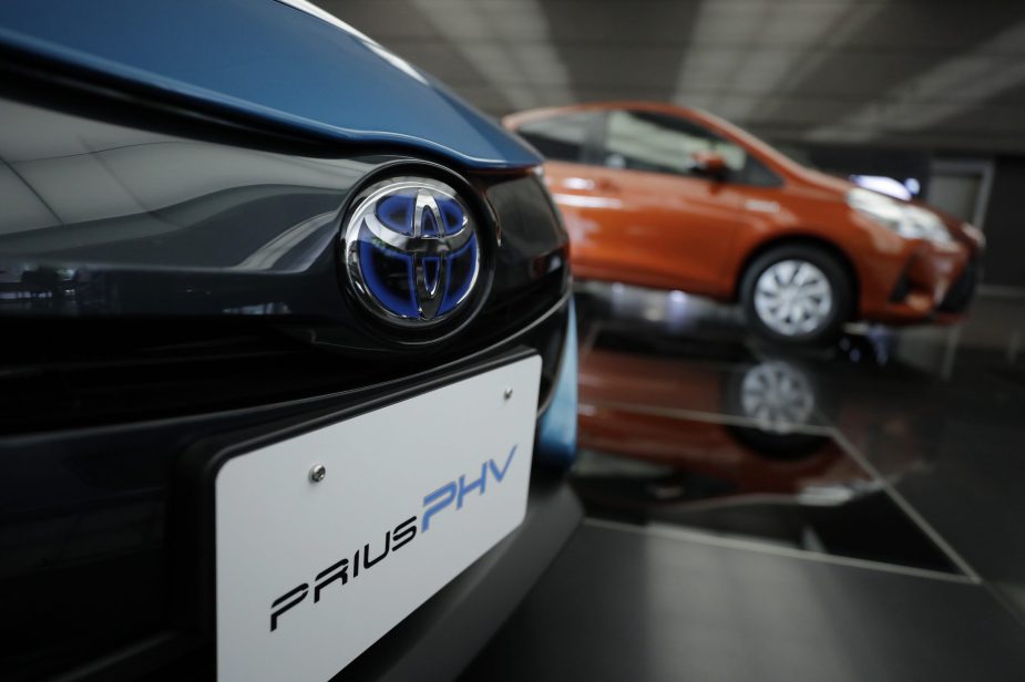 A Toyota Motor Corp. badge is displayed on a Prius plug-in hybrid vehicle (PHV), known as Prius Prime in the U.S., at the company's head office in Tokyo