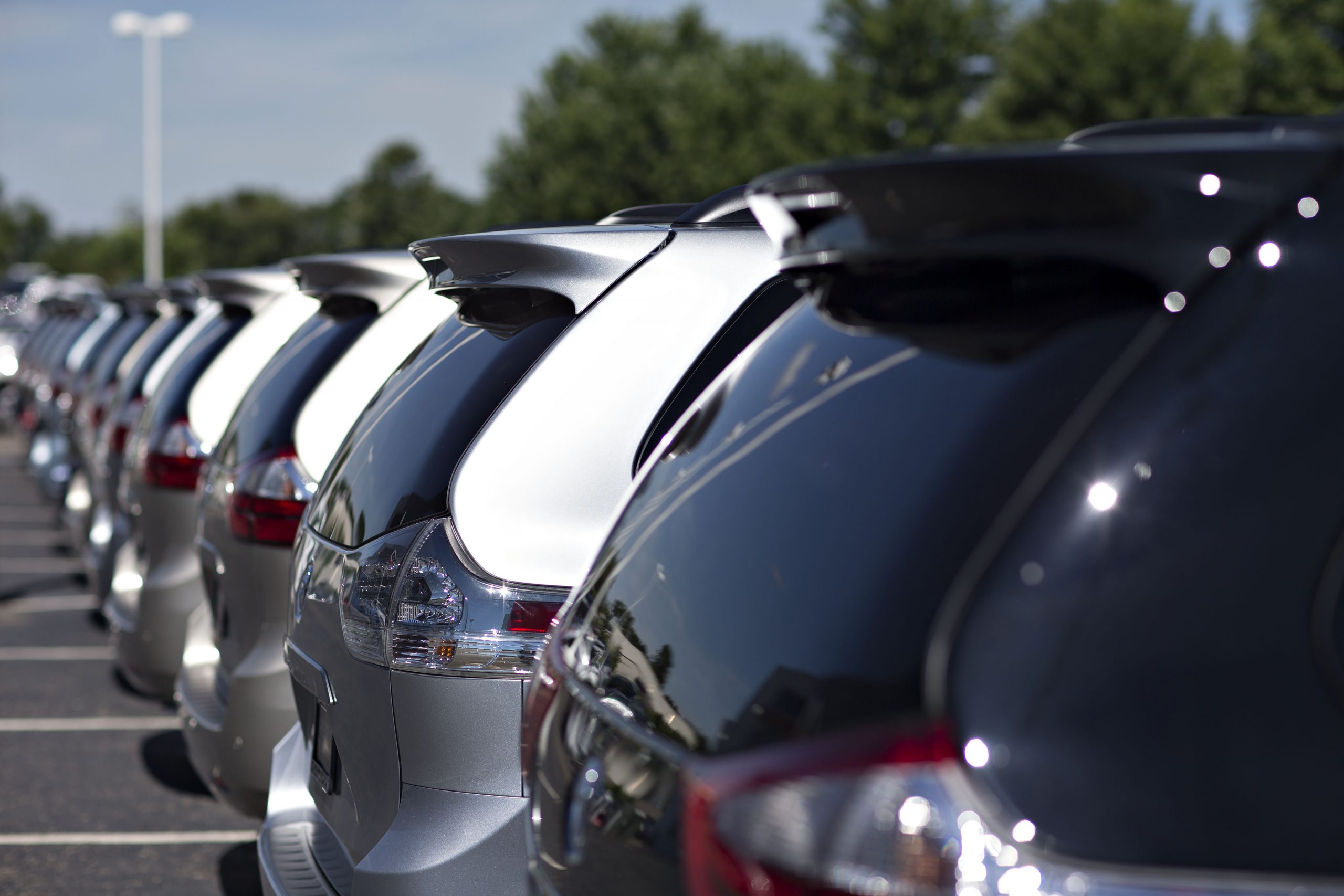 A row of 2021 Toyota Sienna minivans at a dealership with new feature making them the perfect van for families