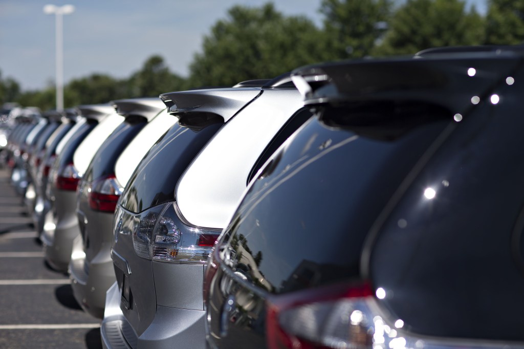 A row of Toyota Sienna minivans at a dealership