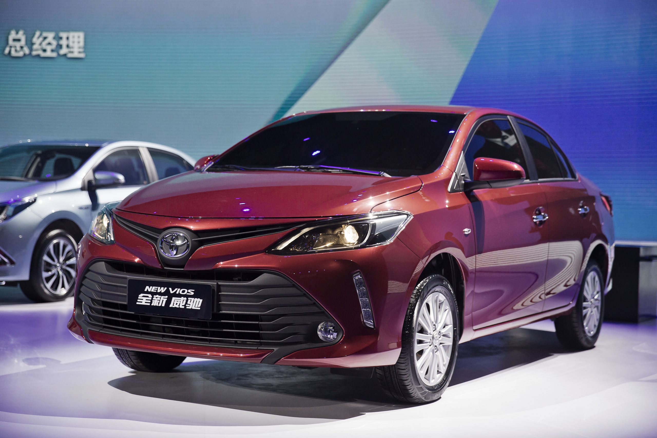 A red Toyota Vios on display
