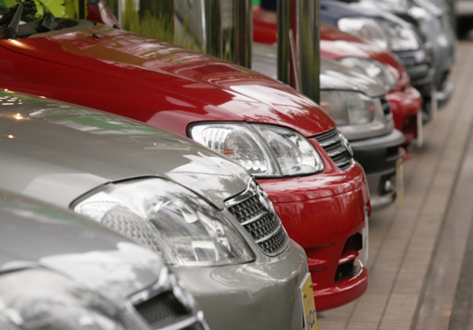 Rows of Toyota Corolla vehicles await buyers at the Toyota Corolla showroom in Tokyo, Japan, on Monday, March 5, 2007