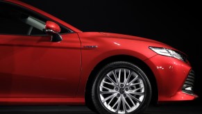 A red Toyota Camry on display during an event