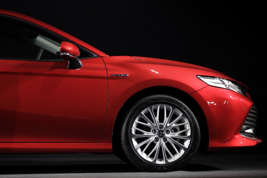 A red Toyota Camry on display during an event