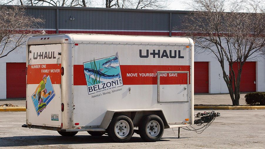 U-Haul trailer looking abandoned in a parking lot