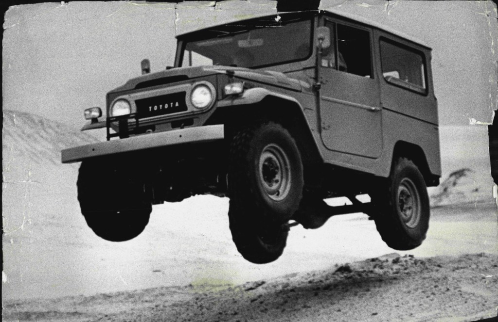 A 1970 Toyota Land Cruiser jumping sand hills