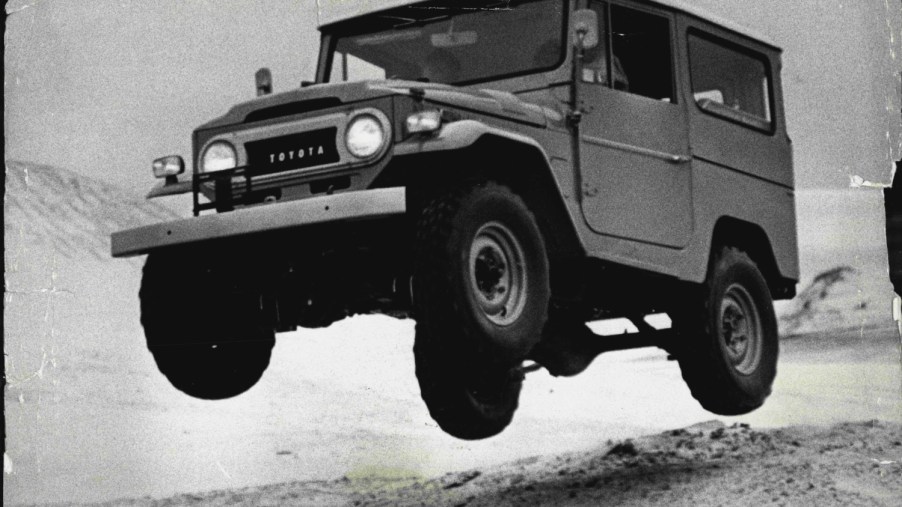 A 1970 Toyota Land Cruiser jumping sand hills