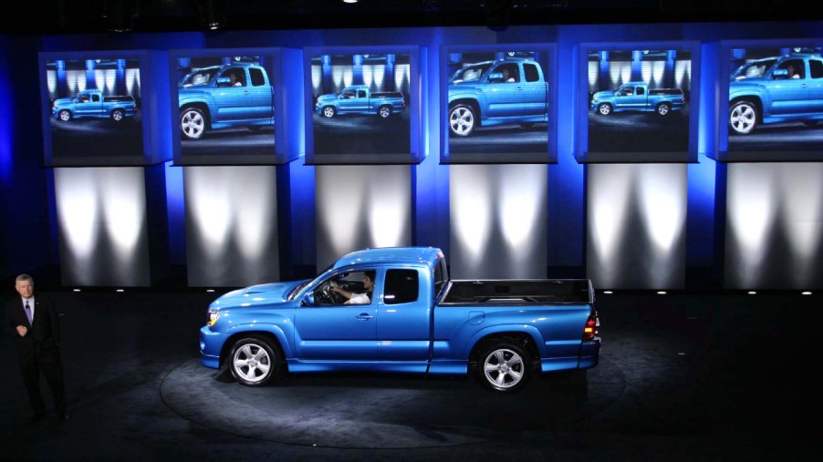 A blue Toyota Tacoma X-Runner on display at a show