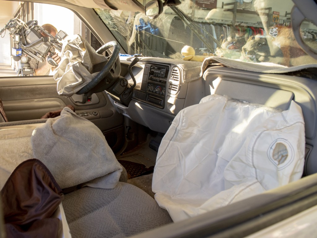 A set of deployed air bags in a car