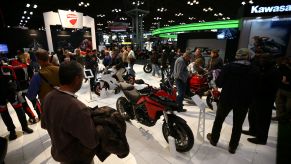 Visitors look at motorcycles from various brands at the Progressive International Motorcycle Show