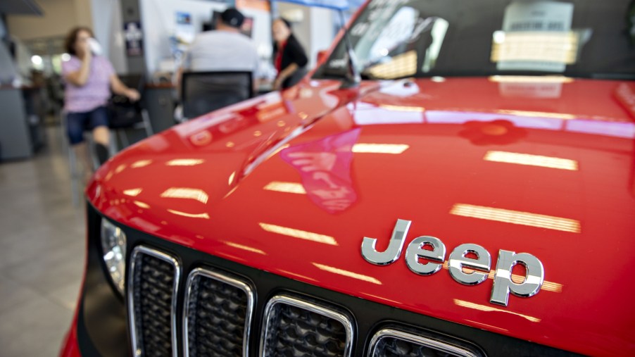 A red Jeep Renegade SUV sits on display