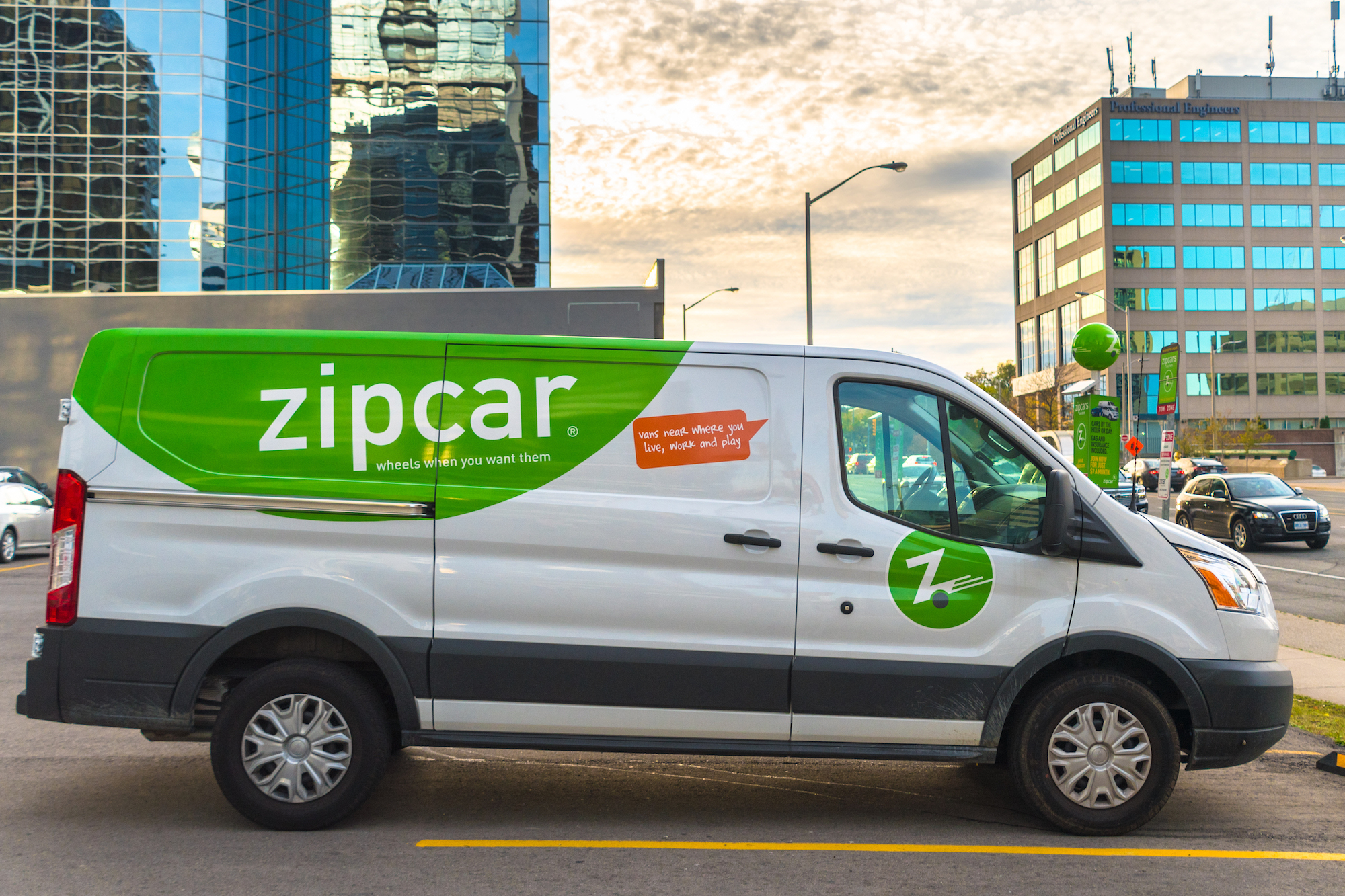 Zipcar rental cars include this white-and-green van parked in a Yonge Street parking lot in Toronto, Ontario, Canada