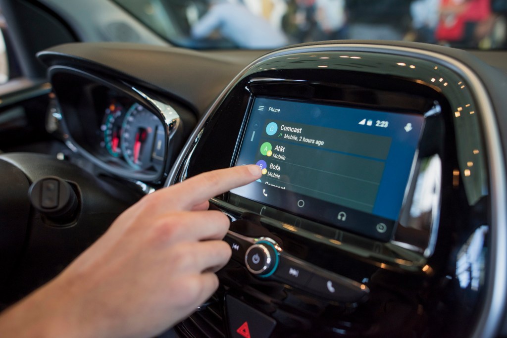 An attendee demonstrates Android Auto in a Chevrolet Spark car during the Google I/O Annual Developers Conference