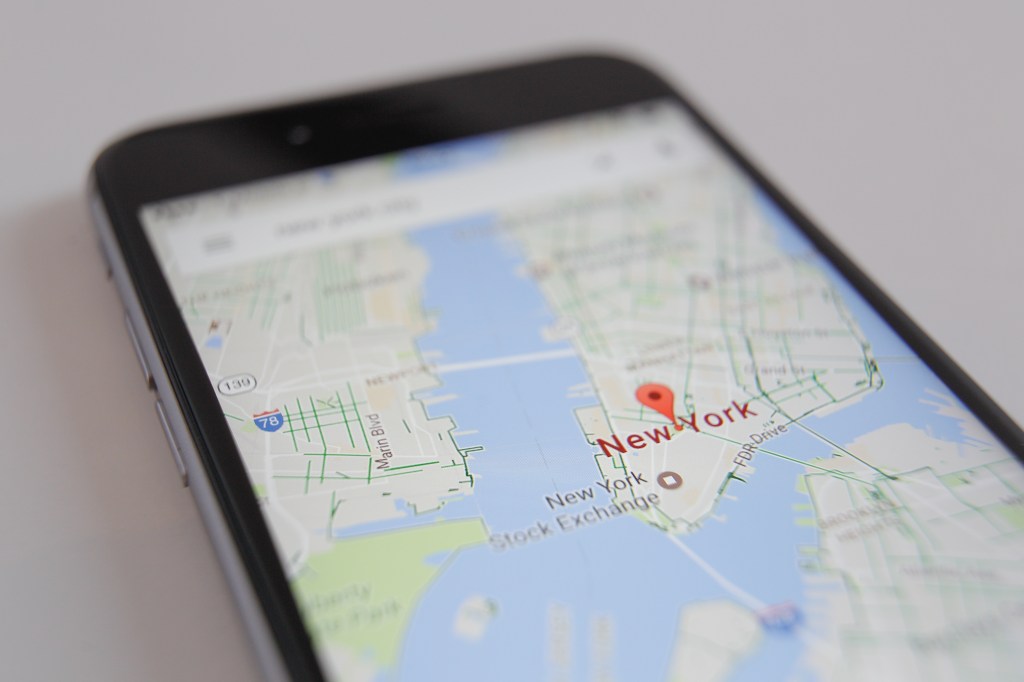 The Google Maps app is seen displaying part of the Manhattan district on a smartphone. 
