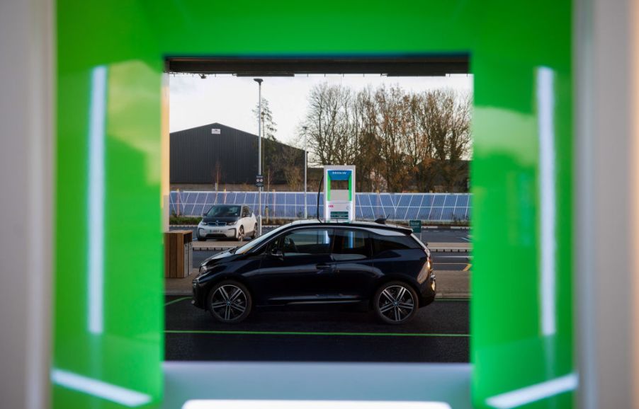 a gray BMW i3 pictured through a green frame