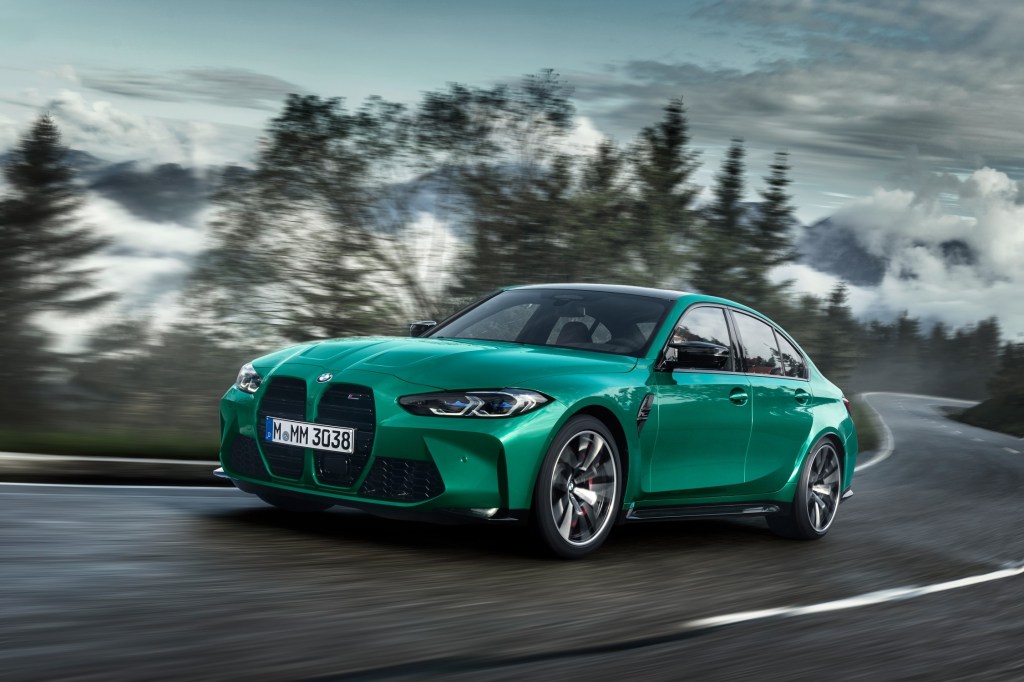An emerald green BMW M3 action shot 